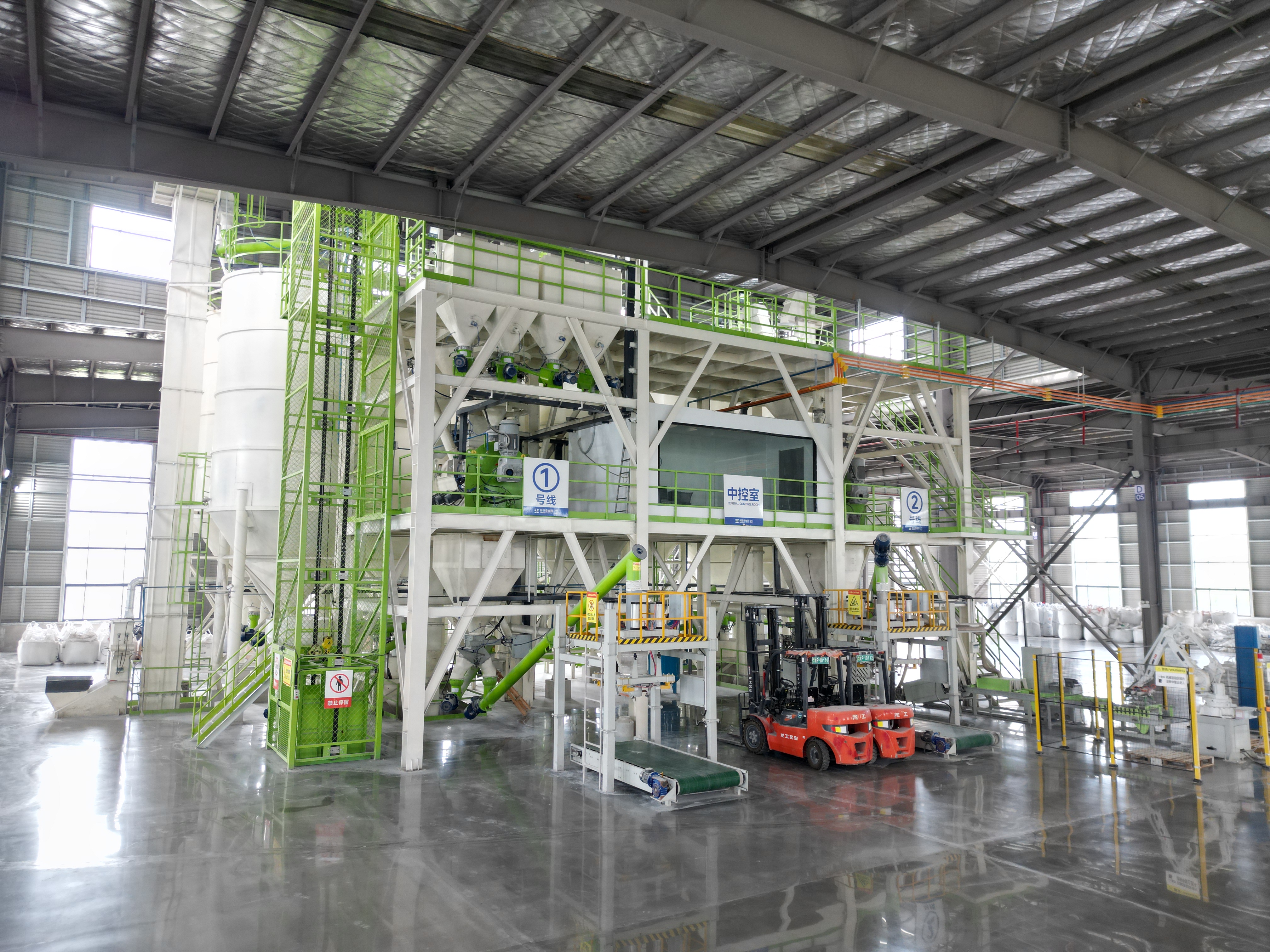 Automated production line with forklifts and bagging equipment